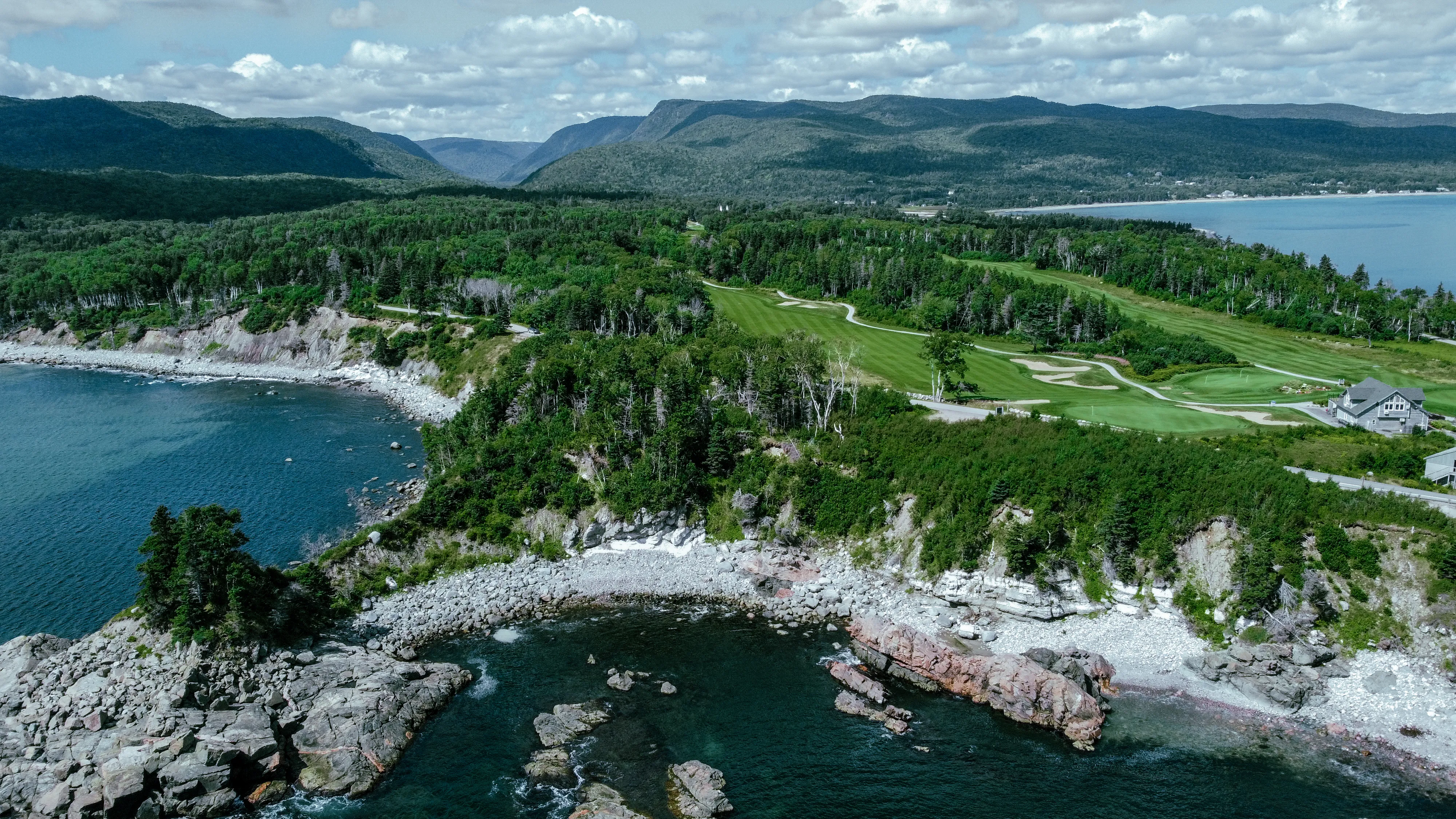 Aerial view of Highlands Links along the rocky Atlantic shoreline.